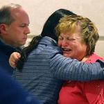 Linda Pelletier was consoled by her attorney, Christine Tennyson, after the hearing as Linda's husband, Lou, looked on. 